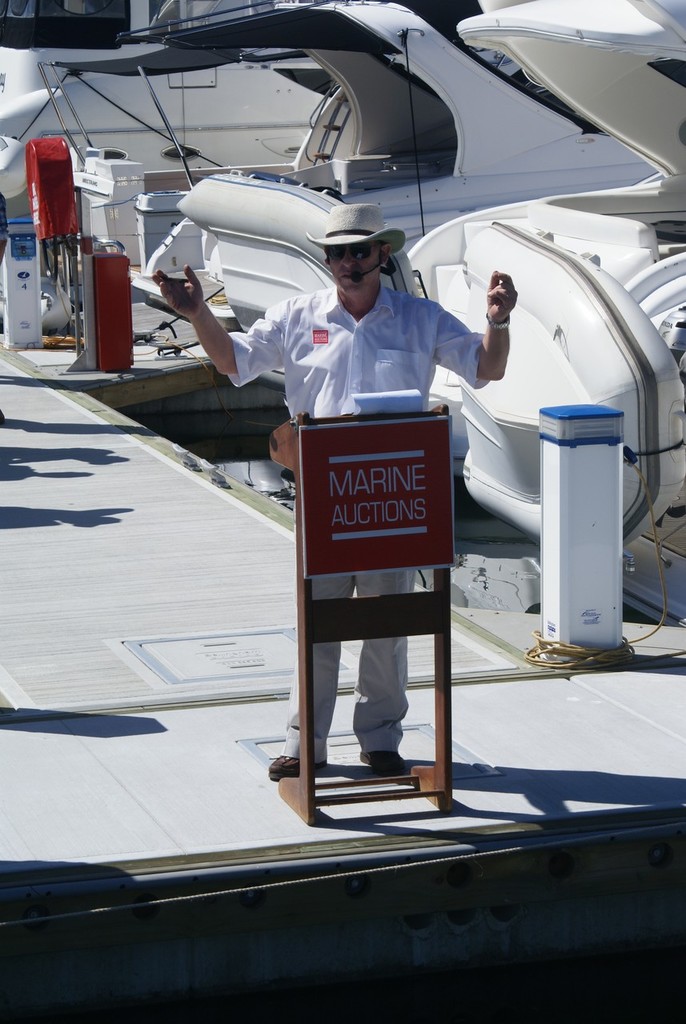 Adrian Seiffert goes to work aqnd tempts buyers at the Runaway Bay Marina auction staged by Marine Auctions.  © Bob Wonders